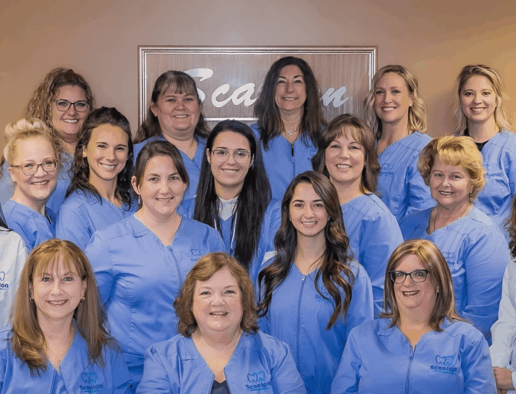 Dental team at Scanlon Family Dental wearing blue uniforms in clinic