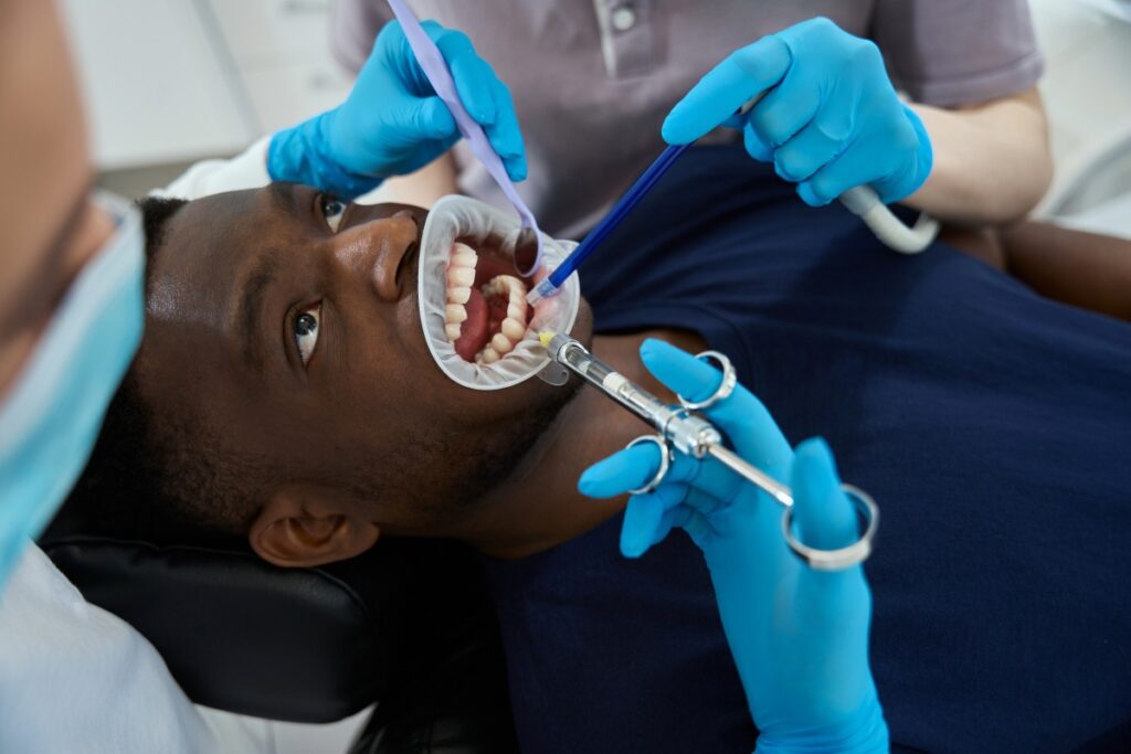 Patient receiving dental treatment during a routine dental procedure
